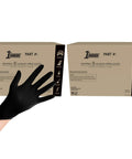 Two boxes of 1st Choice black nitrile disposable gloves, 5 mil, XXL; industrial/food prep use with glove in foreground.