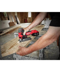 18V Cordless Jig Saw With Barrel Grip in use cutting a wood plank, showing precise handling for DIYers and pros, bare tool only