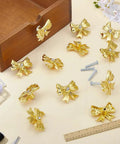 12 Pack Gold Bow Drawer Knobs Set For Vintage Dresser And Cabinet Diamond Accent Zinc Alloy Pulls displayed with screws