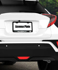 Forest Wildlife License Plate Frame Aluminum Car Tag Frame With Two Holes And Screws Weatherproof, mounted on a white car.