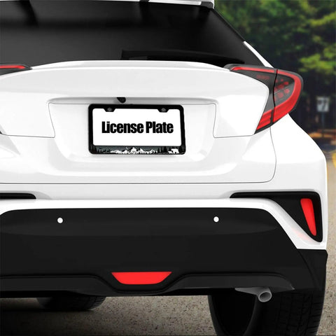 Forest Wildlife License Plate Frame Aluminum Car Tag Frame With Two Holes And Screws Weatherproof, mounted on a white car.