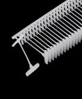 Top Rated 5000 Piece Plastic Tagging Gun Fasteners 0.5 Inch White Barbs That Lock Tight On Clothing And Retail Items Smooth Sailing With Wide Paddle Tips No Fuss Garment Label Refills in a close-up view showing durable white plastic barbs.