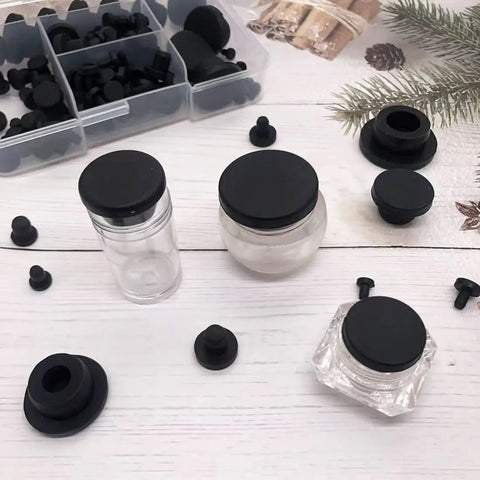 Kickass 115 Piece Silicone Hole Plugs Set With 10 Sizes T Style Rubber Stoppers For Powder Coating and No Sweat Tube Cap Sealing Heavy Duty Grommet Kit For Daily Use, showcasing black rubber caps on jars.