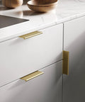 Six Pack Adhesive Cabinet Handles in gold finish on kitchen drawer, no drill, easy install, aluminum alloy, 100mm length