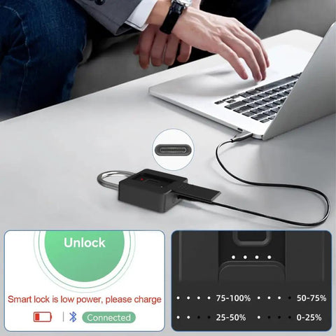 Beefy Biometric Fingerprint Padlock With Bluetooth App Control charging via laptop on a table