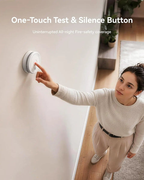 Hassle Free Smoke Detector Designed With Adaptive Sensing To Slash Nuisance Alerts While Delivering Dependable Household Fire Protection Runs Smooth On A Single Nine Volt Battery Offers Quick Easy Wall Install, woman testing alarm.