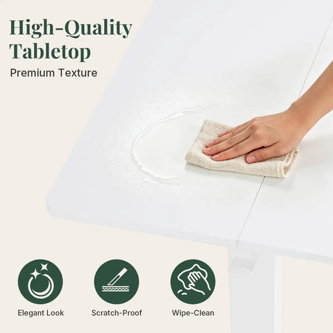 Person wiping water off the high-quality tabletop of the 48 Inch Electric Standing Desk Height Adjustable Sit Stand Workstation With Silent Motor Memory Presets And Wide White Top Designed For Home Office Gaming And Crushing The Daily Grind Stress Free.