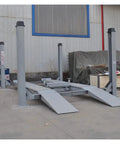 Professional Grade Heavy Duty Four Post Car Lift Featuring Steel Wire Rope Hoist System And Seven Thousand Pound Capacity Built Like A Tank For The Daily Grind with gray steel frame.