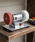 Sick Smooth Mini Bench Grinder Stainless Steel Electric Desktop Belt Sander With No Sweat Knife Sharpening on wooden shelf.