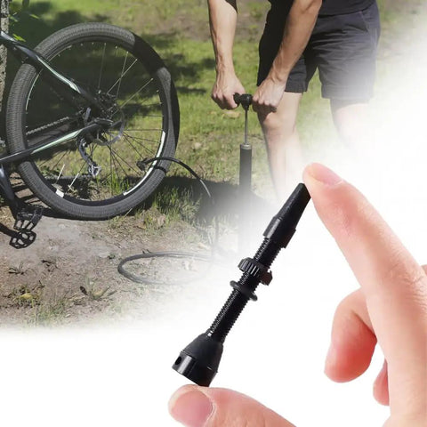 Close-up of 8 Pack Presta Valve Stem Kit 44mm 1.74 Inch Tubeless Valve Tools in use on mountain bike tire