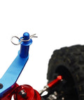 Universal RC Body Clips Pins on 1/10 scale car, steel with silver finish, mounted on blue and red suspension arm with tire background.