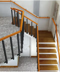 Tough As Nails Side Mount Banister Posts Black Metal Deck Railing Spindles with adjustable brackets on staircase.