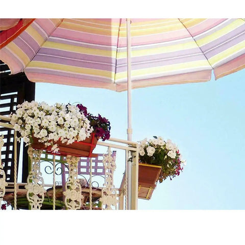 Heavy Duty Umbrella Clamp Holder For Patios And Beach Tents Adjustable Outdoor Shade Mount on balcony with flower pots.