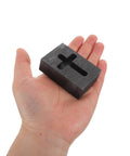 Person holding Graphite Cross Shaped Casting Mold for Melting Trusted by Jewelers High Precision Graphite Tool for Jewelry Casting and Metalworking