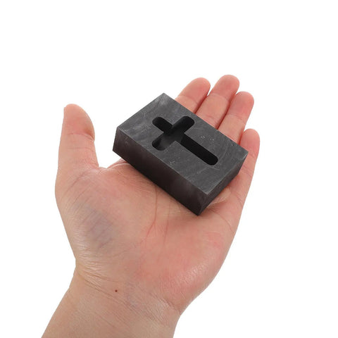 Person holding Graphite Cross Shaped Casting Mold for Melting Trusted by Jewelers High Precision Graphite Tool for Jewelry Casting and Metalworking