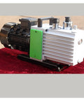 Straight Up Built Tough Two Stage Rotary Vane Vacuum Pump With Direct Coupled Motor And Gas Ballast Valve on lab bench surface.