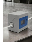 DigiFlow 8000T Flow Meter with one quarter inch quick fitting for precise water monitoring on a counter, ideal for RO systems.