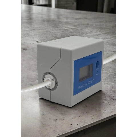 DigiFlow 8000T Flow Meter with one quarter inch quick fitting for precise water monitoring on a counter, ideal for RO systems.