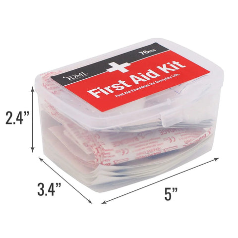 Front view of clear plastic first-aid kit with red label and DMI branding, 76-piece travel kit.