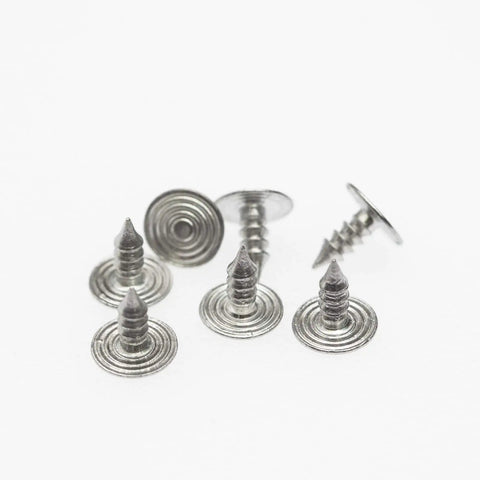 Close-up of 20 Sets Of 17mm Replacement Jeans Buttons Snap Kit With Metal Rivets For Jeans Denim Pants No Sew Button Replacement Durable Riveted Button Set For Quick Fixes.