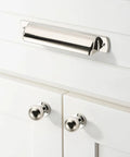 Front view of polished nickel cup pull installed on white cabinet, part of 10 Pack 2-1/2 Inch Polished Nickel Drawer Pulls Cabinet Cup Pulls Kitchen Hardware