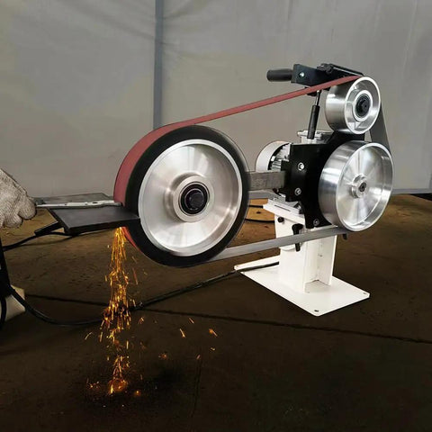 Badass 2X72 Inch Variable Speed Belt Sander And Multi Angle Vertical Horizontal Grinder For Knife Polishing With Three Abrasive Wheels And Rock Solid Base 110V 2840 RPM Shop Staple with sparks flying during grinding.