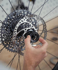 Magura MDR-C 203mm brake rotor; silver perforated disc with black center-lock ring (close-up view).