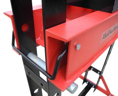 Close-up view of Real Deal 40 Ton Air Hydraulic Shop Press showing red and black structure, ideal for automotive repair jobs.