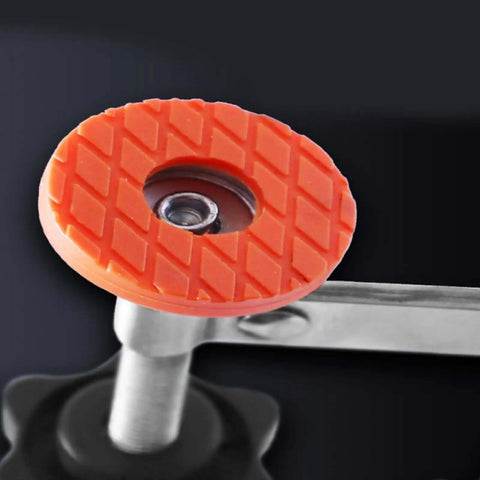 Close-up of red anti-slip pad of stainless steel toggle clamps with vertical release adjustable for woodworking and welding