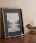 L Shaped Aluminum Shelf Bracket in Gold Finish for Wall and Desktop Display holding a wooden photo frame securely on a table