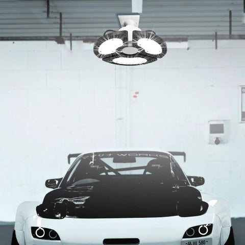 Two Pack 80W LED Ceiling Light With 9600 Lumens And 3 Adjustable Panels above a car in garage 6000K Daylight CRI80