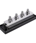 Beefy 600Amp 4 Post Power And Ground Distribution Busbar With Nickel Plated Copper Terminals 3/8 Inch Studs 14Mm Locknuts Rock Solid Car Audio Wiring Harness Setup Made In Usa Black on a black base with four terminals.