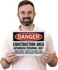 Person holding a 'Danger Construction Area Authorized Personnel Only' sign, 9x12 inches, for hard hats and safety glasses, OSHA compliant.