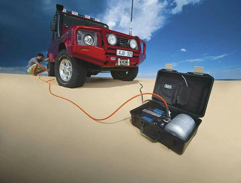 Heavy Duty Road Trip Ready 12 Volt Twin Motor Portable Air Compressor with aluminum tank used for off-road tire inflation.