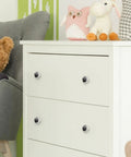 4 Pcs 1.37 Inch Round Glass Cabinet Knobs Black Butterfly Design on white dresser, accented by toys and decor.