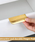 Gold Edge Finger Cabinet Pulls 3.15 Inch Aluminum Drawer Handles being installed on a white cabinet with hidden screws, satin gold finish.