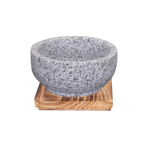 Granite Stone Bowl With Wooden Base For Bibimbap And Korean Stews, shown on wooden tray, side angle view, 24oz size.