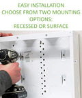 Person installing 28 Inch In Wall Structured Wiring Enclosure With Screw On Cover For Clean Hidden Wall Install No Mess, Glossy White EN2800