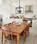 Six Light Black Modern Farmhouse Square Pendant Chandelier For Foyer Hallway Stairway Kitchen Island Dining Living Room 15.75 Inch Wide 22.4 Inch High With 35.4 Inch Chain Length hanging in a rustic kitchen.