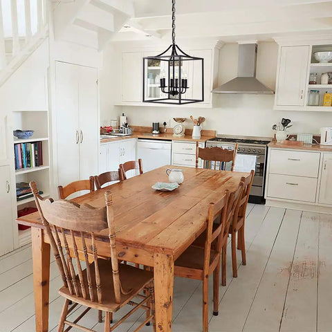 Six Light Black Modern Farmhouse Square Pendant Chandelier For Foyer Hallway Stairway Kitchen Island Dining Living Room 15.75 Inch Wide 22.4 Inch High With 35.4 Inch Chain Length hanging in a rustic kitchen.