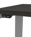 Heavy Hitter L Shaped Electric Standing Desk With Pretty Dang Smooth Motorized Lift showing control buttons and deep grey top.