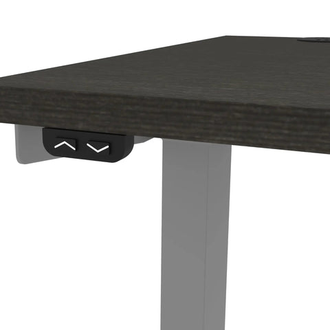 Heavy Hitter L Shaped Electric Standing Desk With Pretty Dang Smooth Motorized Lift showing control buttons and deep grey top.