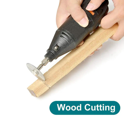 Eight Piece Rotary Drill Saw Blades Set With One Eighth Inch Shank cutting wood using handheld rotary tool