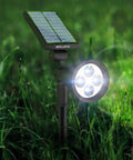 Ultra Bright Solar Spotlight 2 Pack with All Weather Waterproof Design, Auto On Off Sensor, 270 Degree Adjustable Beam in garden