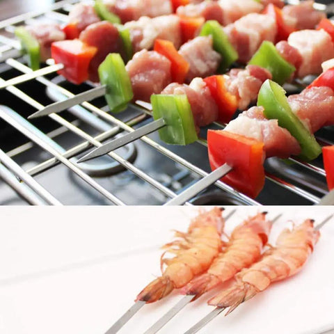 12 Pack 22 Inch Stainless Steel Kabob Skewers With Wide Reusable Nonslip Wooden Handles Heavy Duty BBQ Skewers For Shish Kebabs Chicken Shrimp And Vegetables Perfect For Backyard Grill Outs Easy To Clean, loaded with meat and vegetables on a grill.