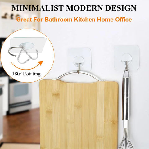 Two clear Heavy Duty Adhesive Hooks Up To 15 Lbs With 180 Degree Rotating Design holding kitchen utensils on a wall.