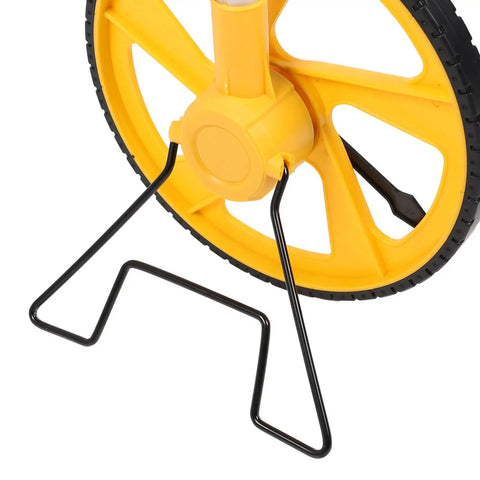 Phefop Digital Measuring Wheel with Backlit Display Telescopic Pole close-up of yellow wheel and black stand, ideal for accurate measurements.