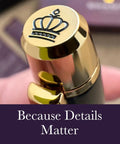 Close-up of a 24 Karat Gold Luxury Rollerball Pen With Gloss Black Finish, crown detail on cap, elite executive gift set focus.
