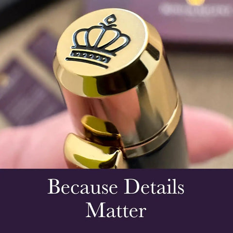 Close-up of a 24 Karat Gold Luxury Rollerball Pen With Gloss Black Finish, crown detail on cap, elite executive gift set focus.