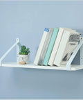 Heavy Duty Metal Corner Braces For Floating Shelves Wall Mount Triangle Shelf Supports Retro Decorative Steel Holder Set Of Two With Crisp White Finish holding books and a plant.